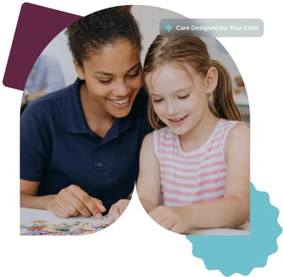 Smiling woman and young girl assembling a colorful puzzle together at a table.
And the text: Care Designed for Your Child