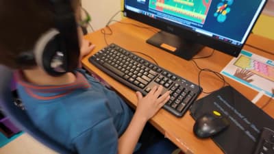 Harmony School of Endeavor student working at a computer during class in Austin.