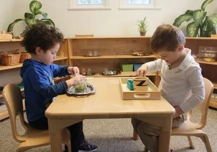 The Family Academy of Bethesda in Bethesda: children completing a practical-life classroom activity.