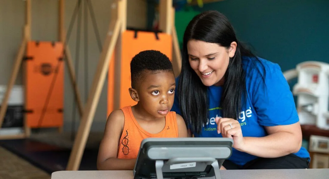 Hopebridge clinician and child working together during care.