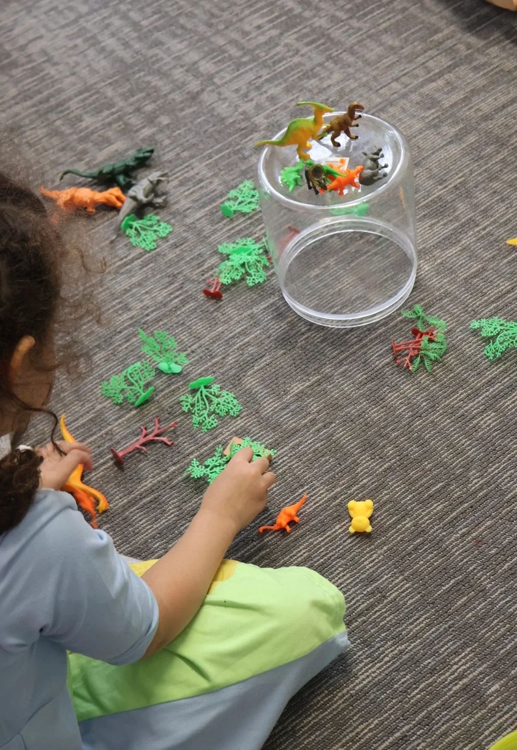 Child participating in a hands-on tabletop activity at Autism Reimagined Center.