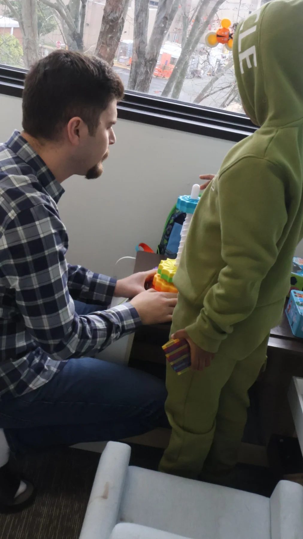 Therapist and child participating in an indoor activity at Autism Reimagined Center.