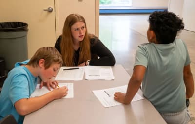 Students working with a teacher at East Orient Elementary School