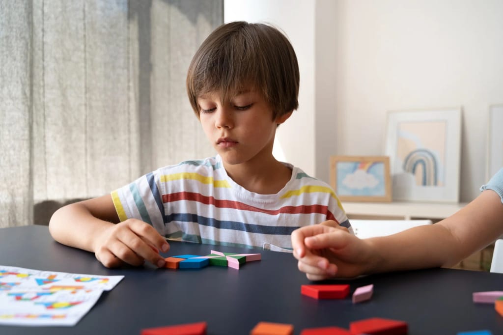 Adult supporting a child with a tabletop activity