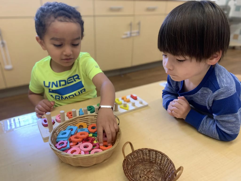 Chinese American International School preschoolers using math materials