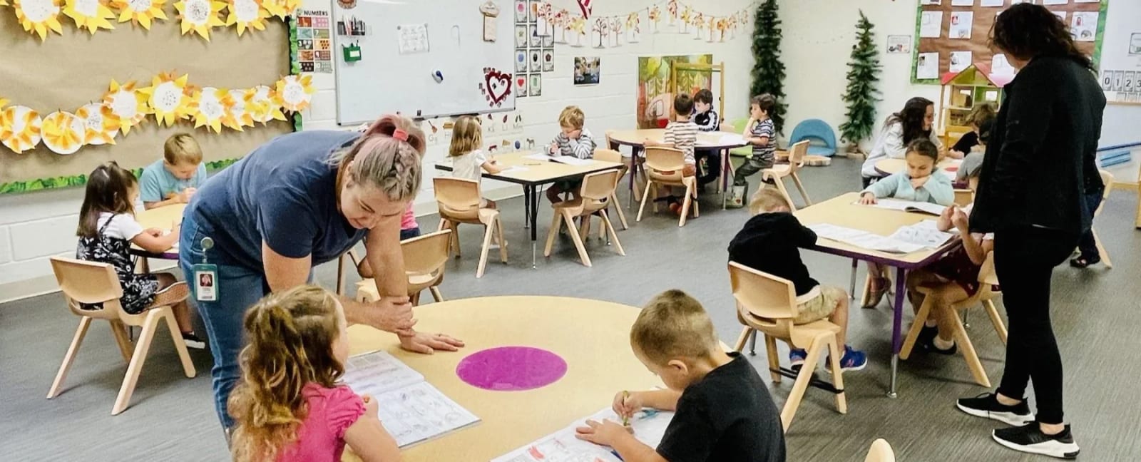 Early Learning Preschool classroom activity with children and teachers.