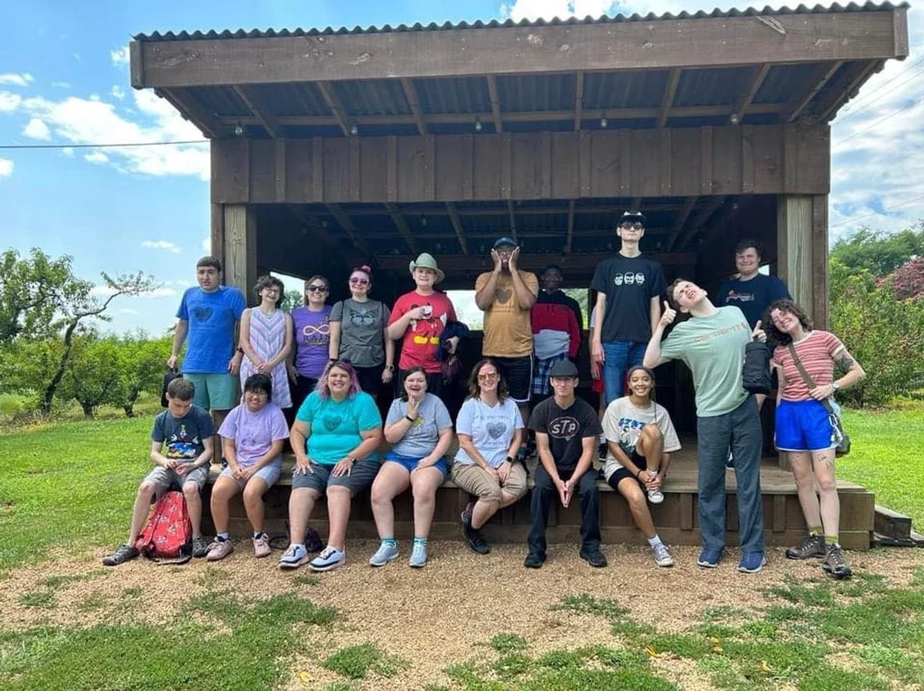 Community group gathered outdoors with Richmond Autism Integration Network.