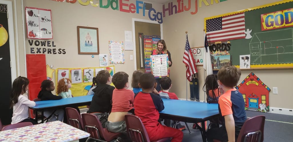 Children participating in a classroom activity at PBC Preschool.