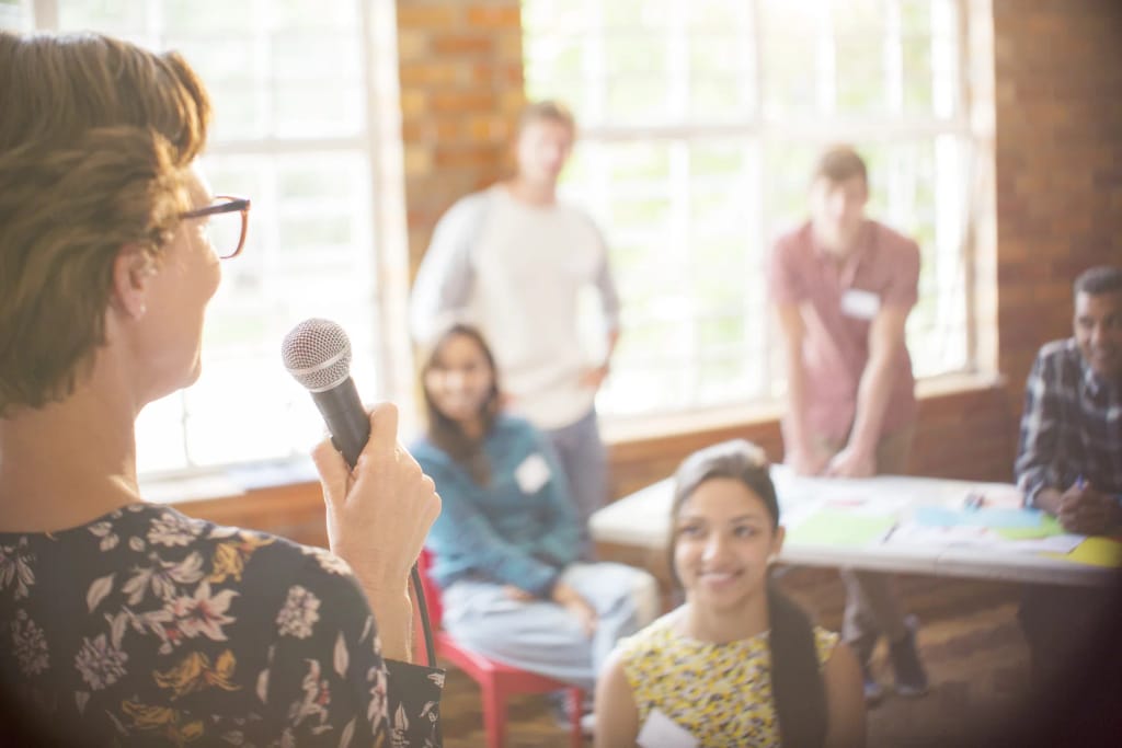 Adult leading a learning activity for children in a classroom