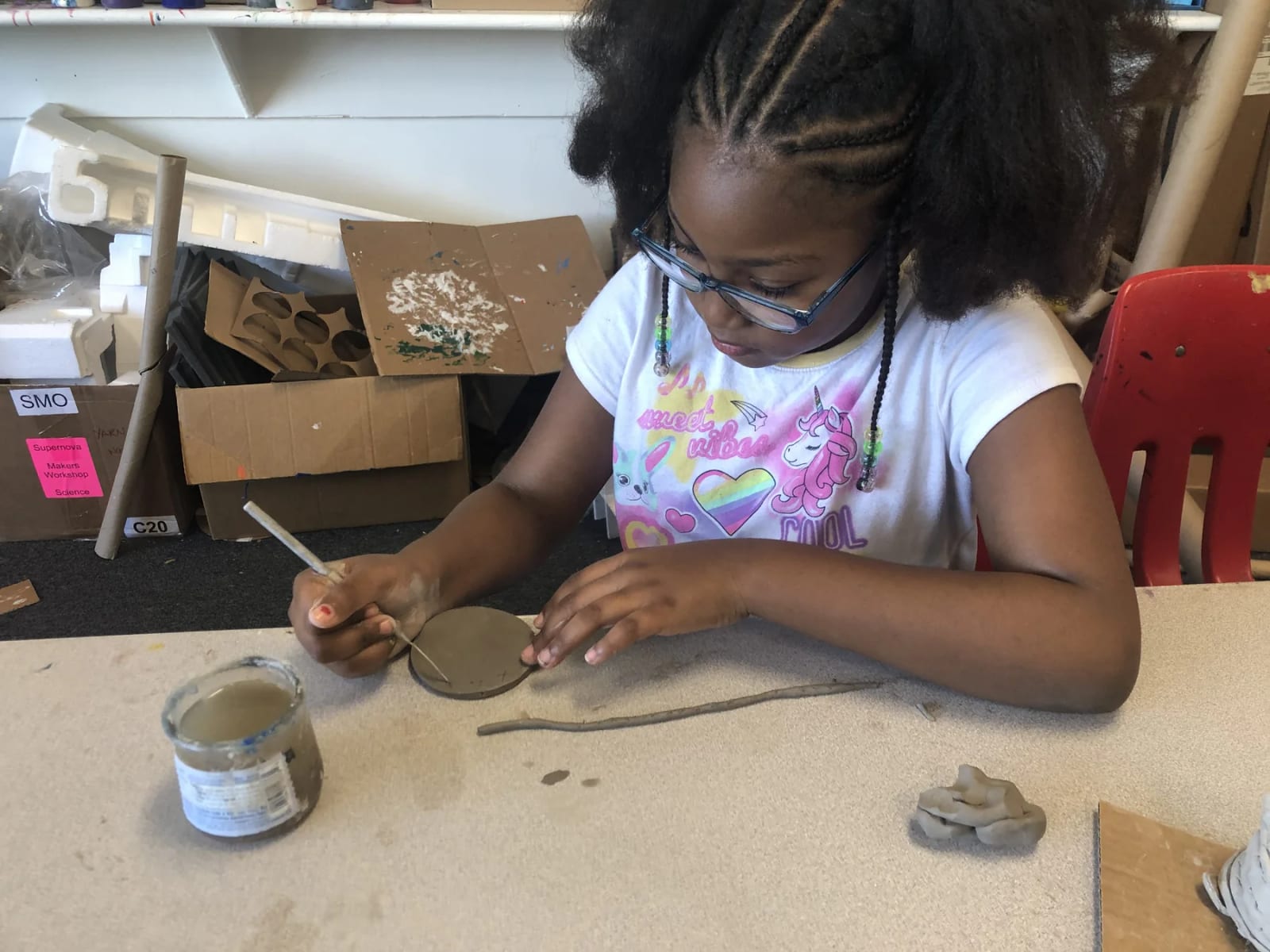 A Learning by Design Charter School student creates a clay classroom project