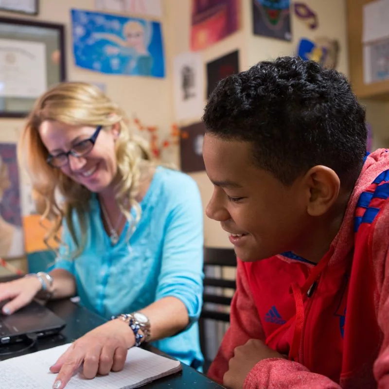 A teacher guiding a student through schoolwork at Fusion Academy - Buckhead