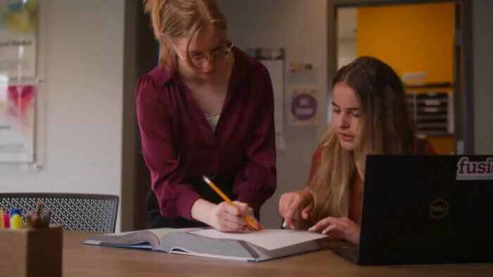 A teacher providing one-to-one instruction at Fusion Academy - Buckhead