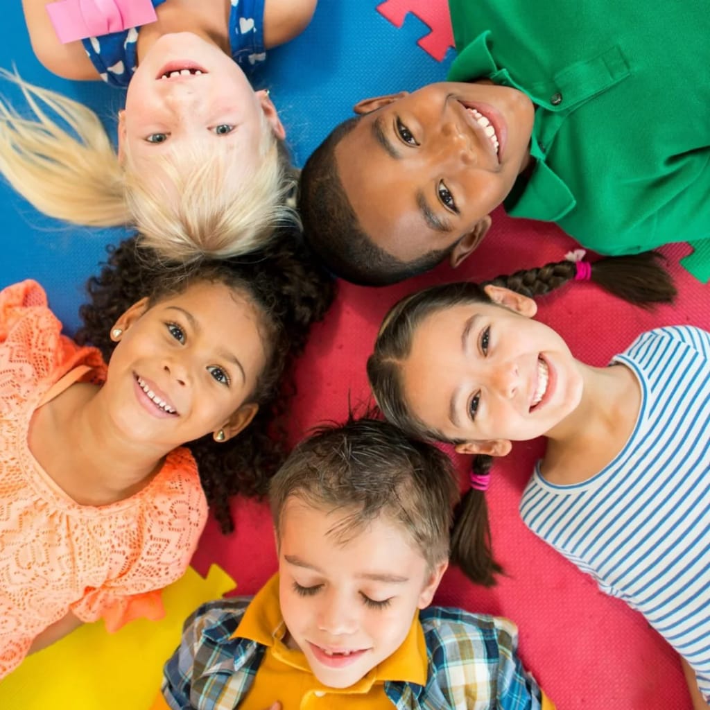 Children lying in a circle during a group activity