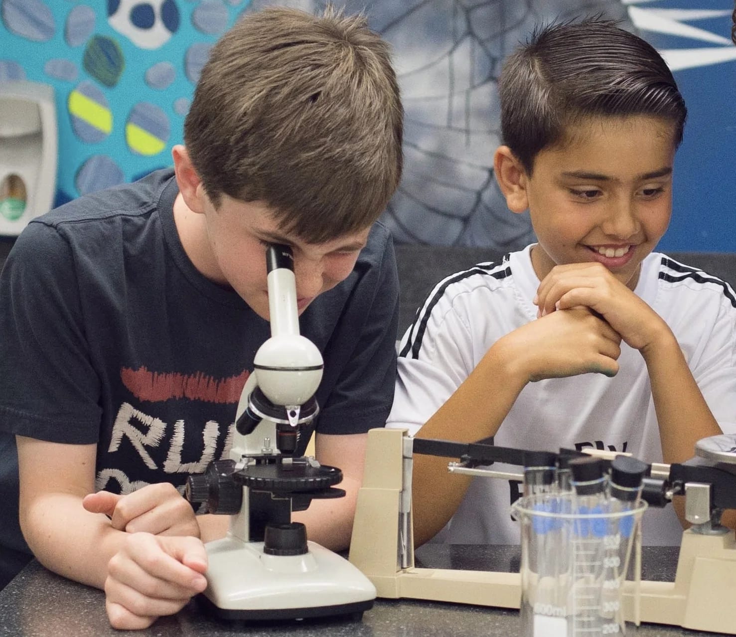 Academy Hill School students using microscopes during a science activity
