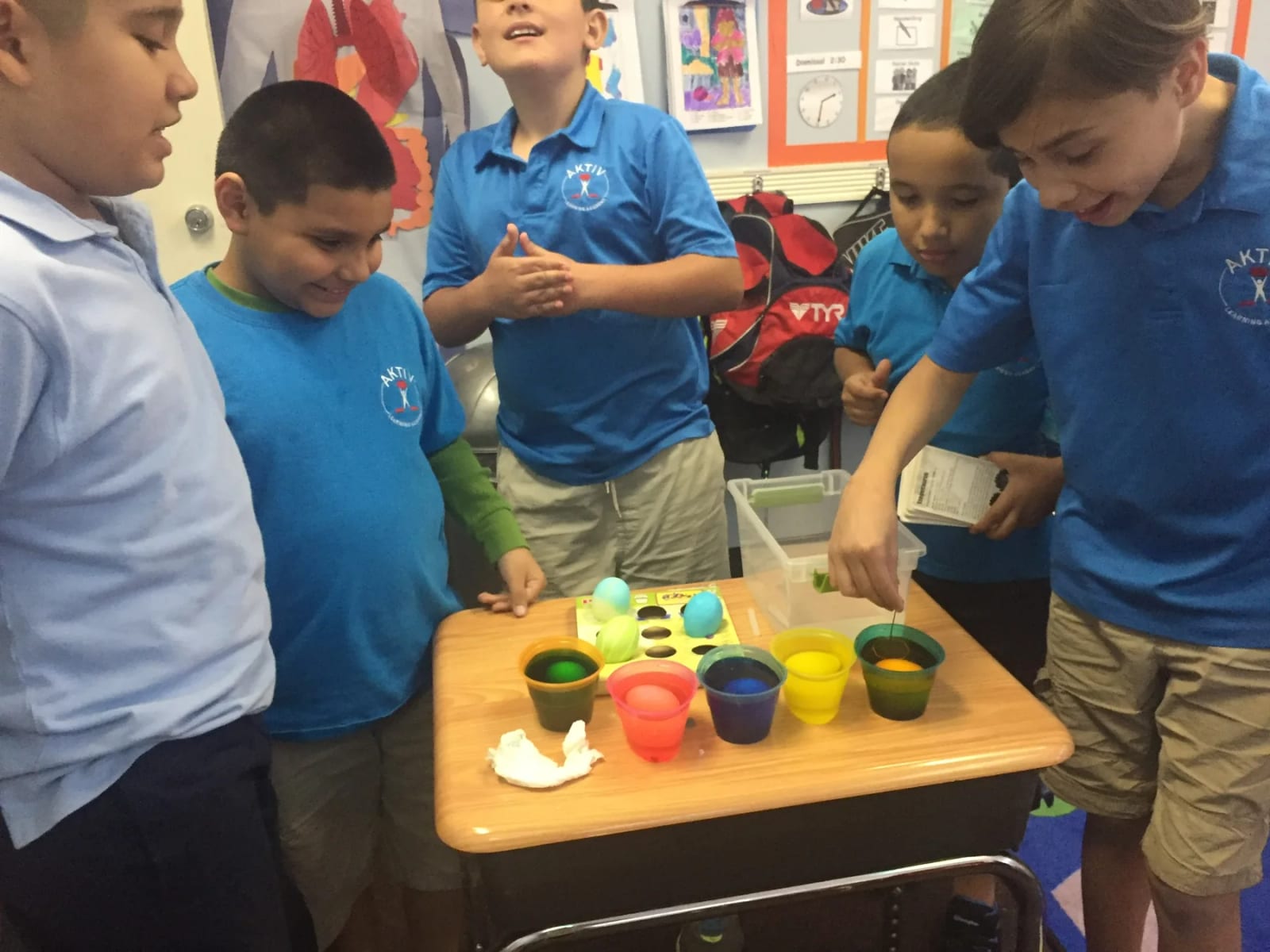 Students working together on a hands-on classroom activity at AKTIV Learning Academy