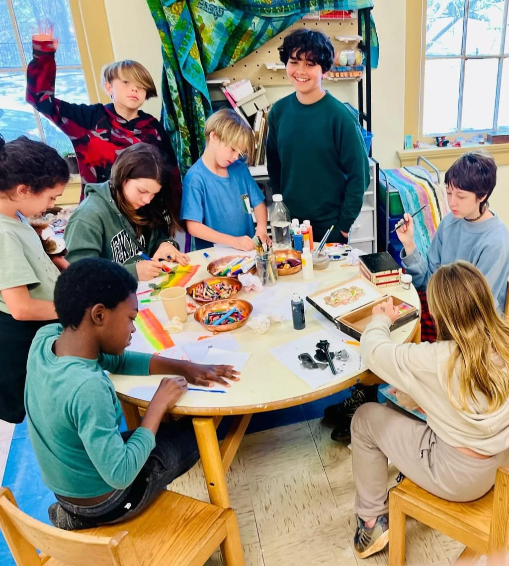 Students working together on a creative project at The Oak House School