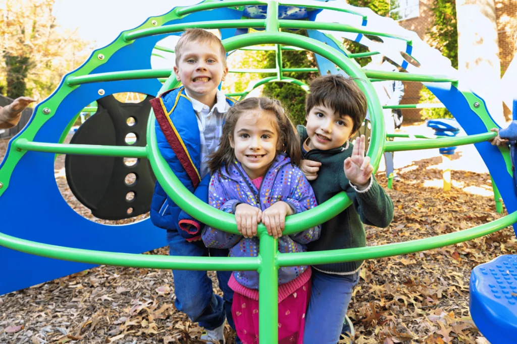Maddux School students playing on an outdoor play structure