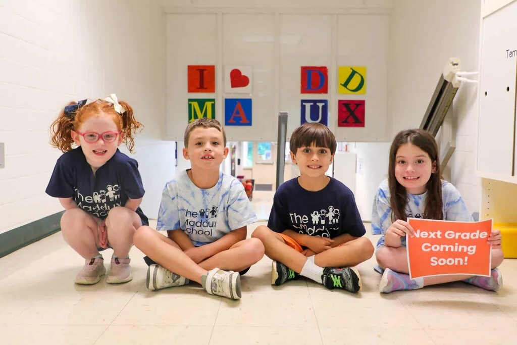 Maddux School students seated together in a Maddux School classroom