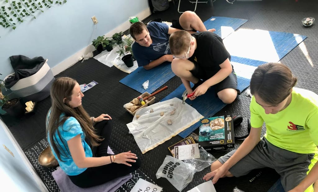 Students working together on a classroom project at Connections School of Atlanta