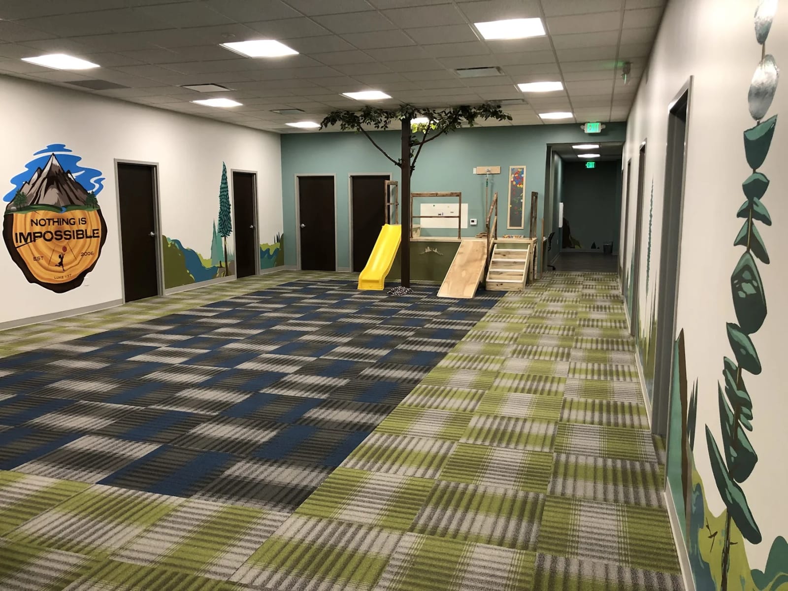 Hallway and play equipment inside Woven Care Pueblo South