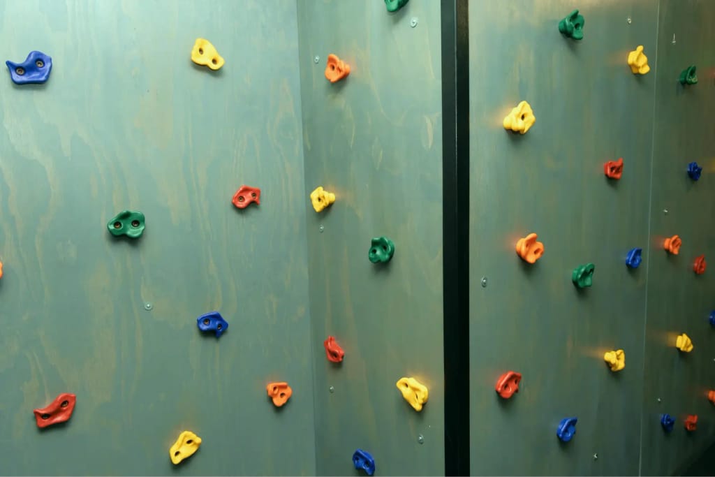 Colorful climbing wall at Woven Care Pueblo South