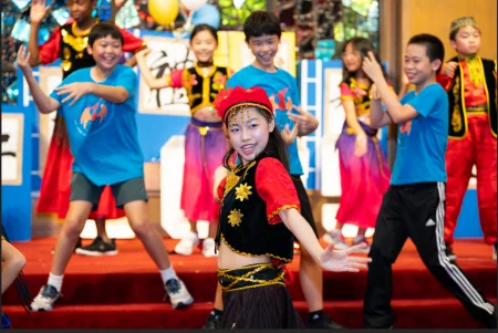 Houston Dragon Academy Pearland Campus in Pearland: students performing at a Houston Dragon Academy cultural event.