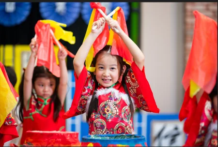 Houston Dragon Academy Pearland Campus in Pearland: students performing with flags at a Houston Dragon Academy event.