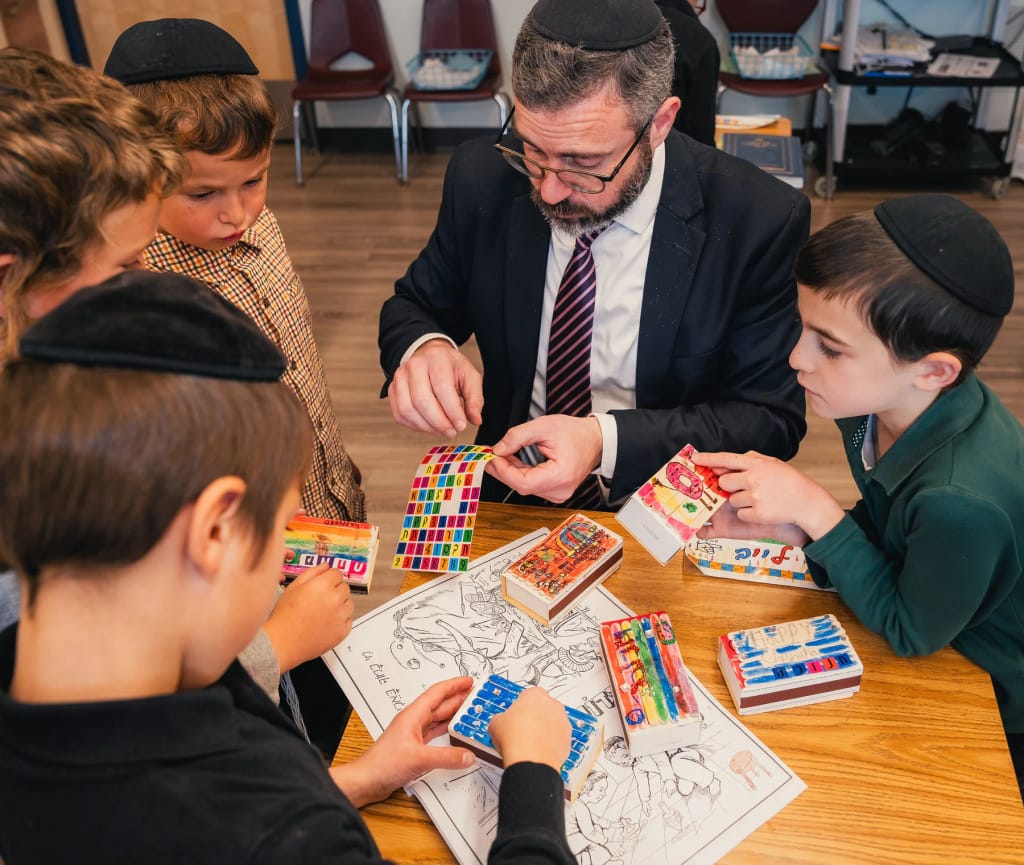Keshet students and teachers working on a hands-on activity