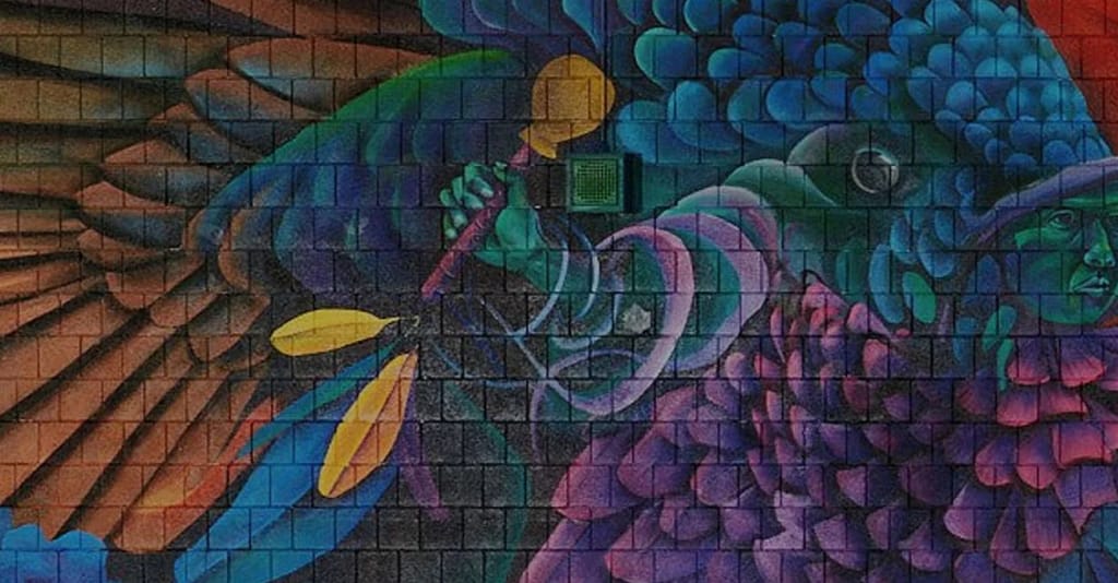 A colorful bird mural at Mario Umana Academy in Boston