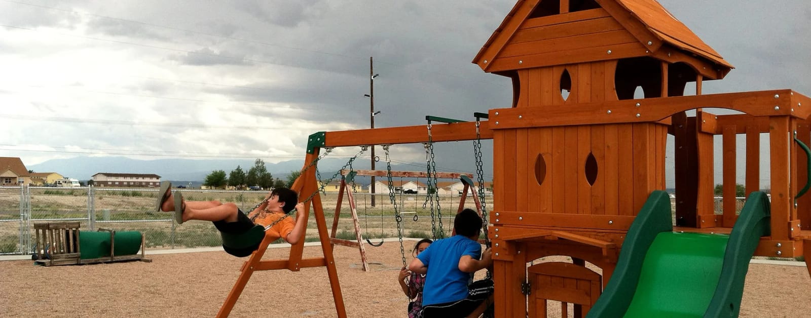 Children using the outdoor play equipment at Soaring Eagles