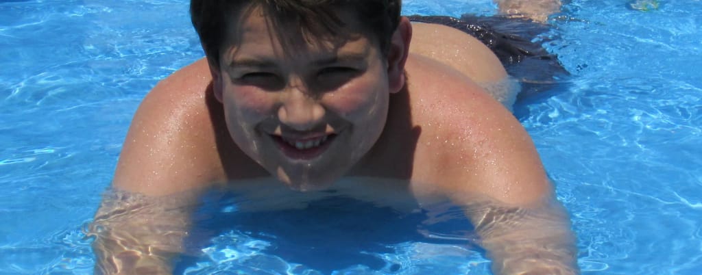 Child swimming during a supervised activity