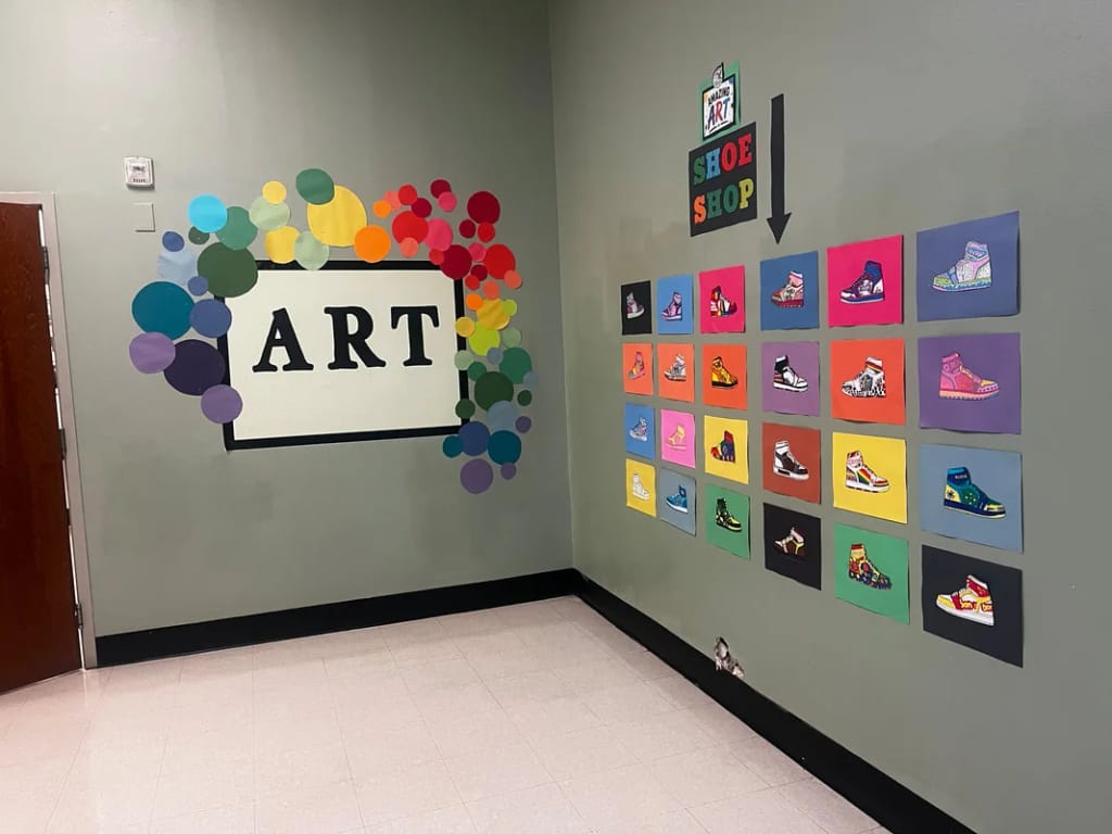 Student art displays line a hallway at Pegasus School in Dallas