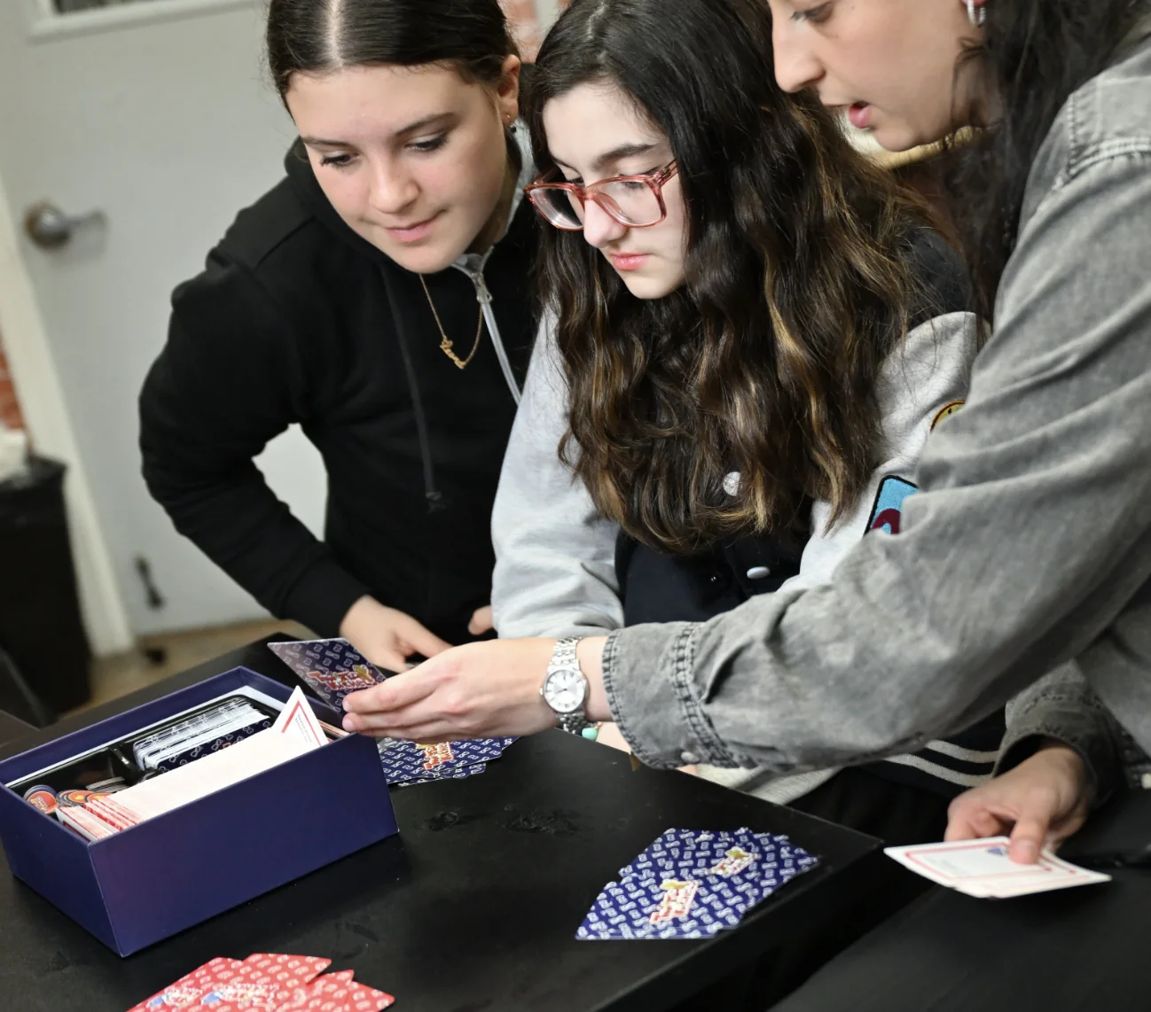 IVDU Elementary Girls School students collaborating at a classroom table