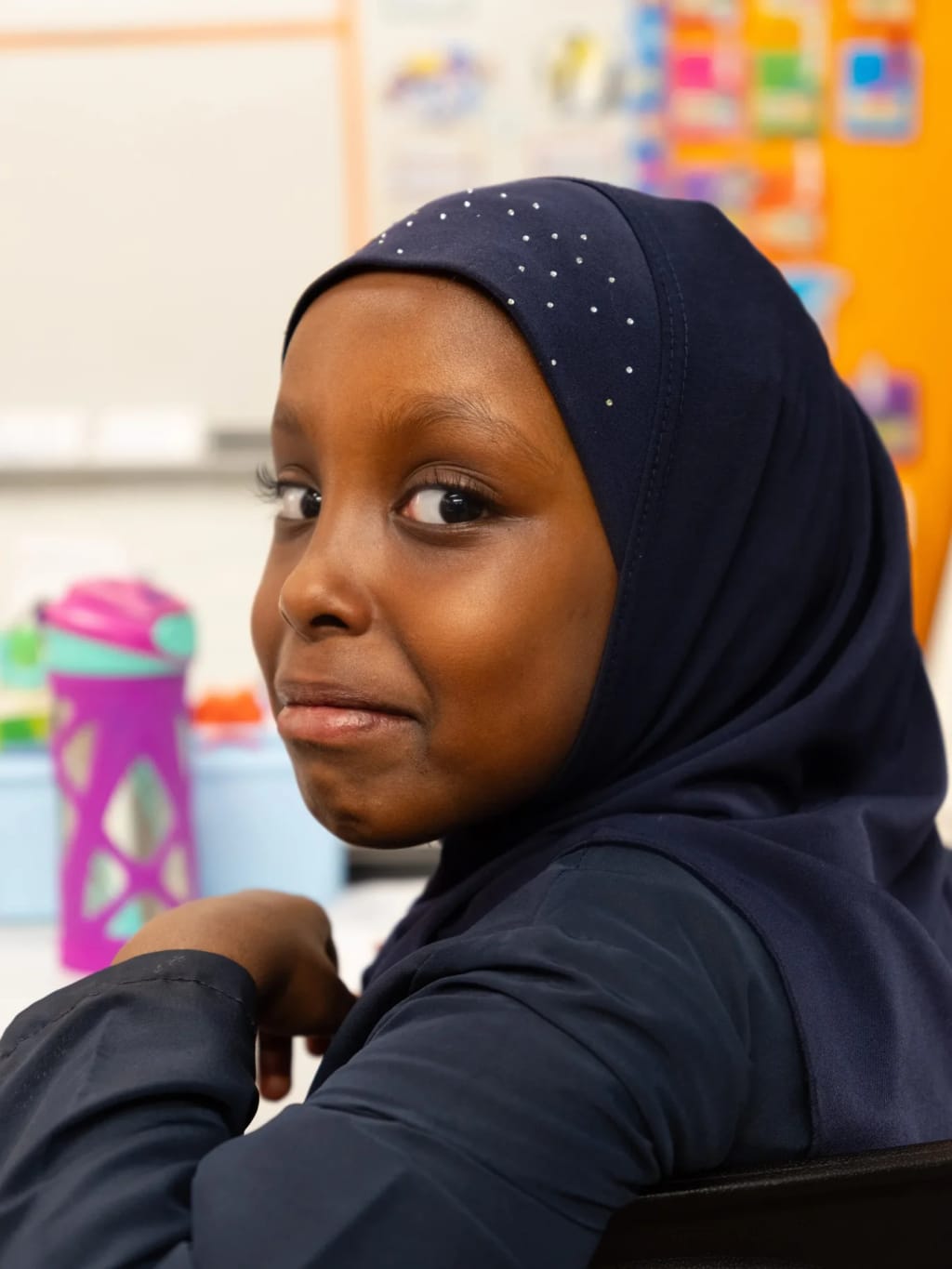 A student seated inside a classroom at Mohammed Schools of Atlanta