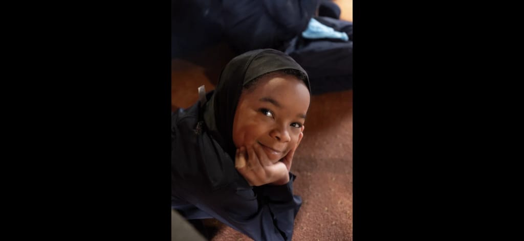 A student relaxing inside the school at Mohammed Schools of Atlanta