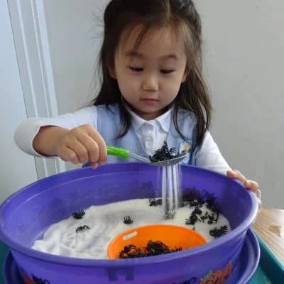 Kinder Academy Montessori child exploring a sensory activity