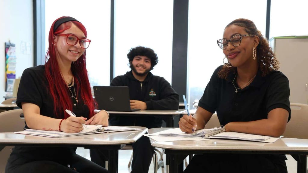 Nicotra Early College Charter students and staff seated in class