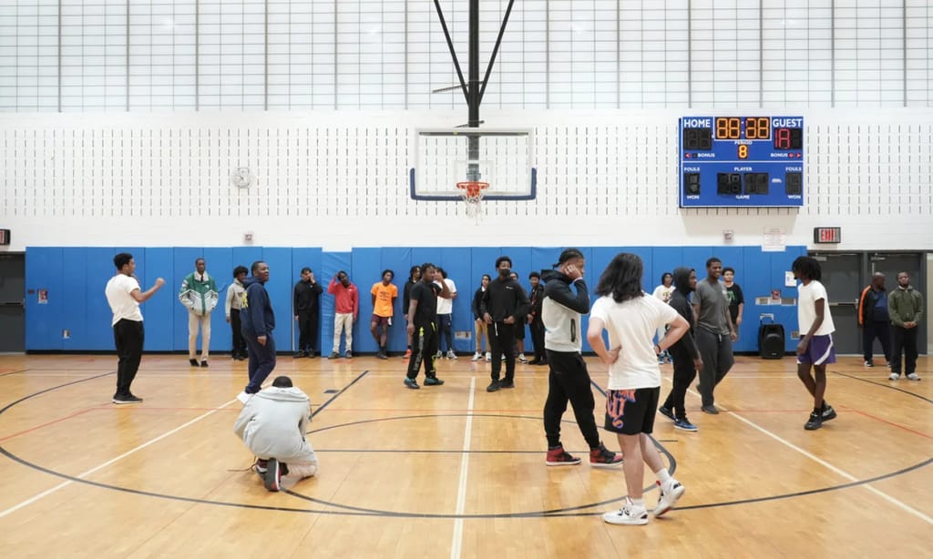 Academy for Scholarship and Entrepreneurship students playing basketball in the gym