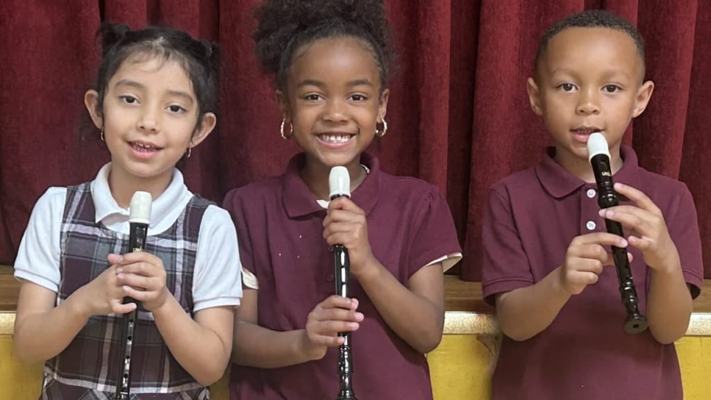 Invictus Leadership Academy students perform music together