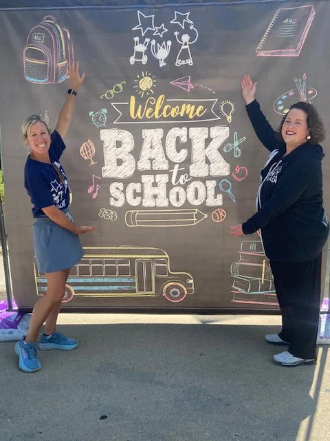 Staff welcoming families back to school at Blair Early Childhood Center