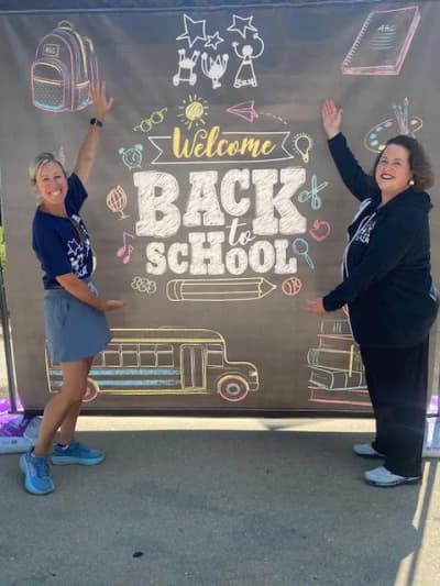 Staff welcoming families back to school at Blair Early Childhood Center