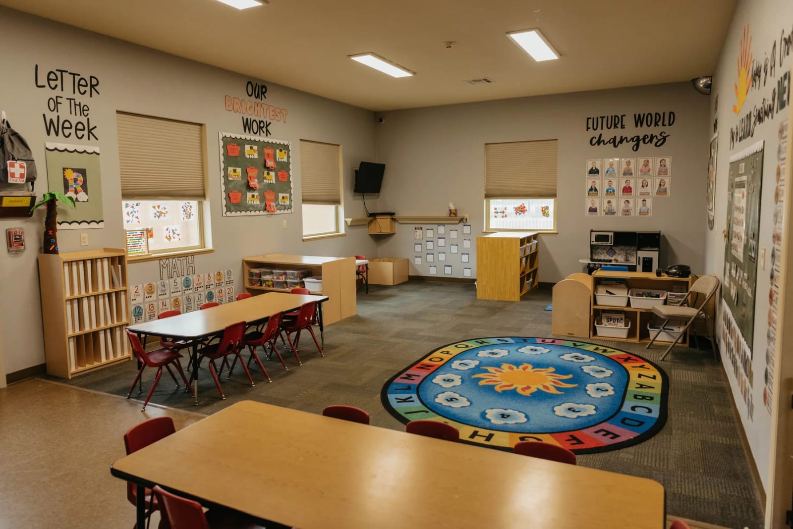 Kids Choice classroom with learning centers and tables.