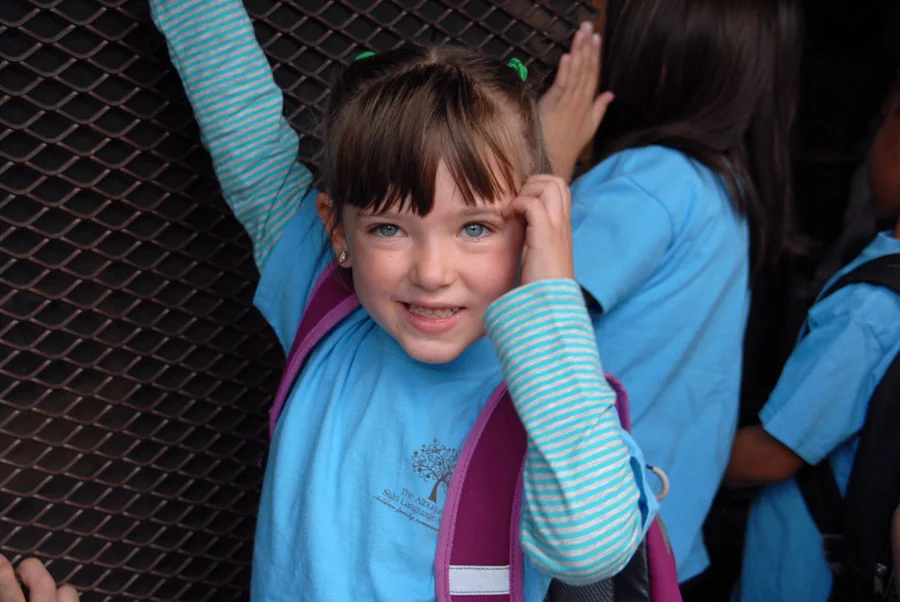 Young Albuquerque Sign Language Academy student using sign language at school.