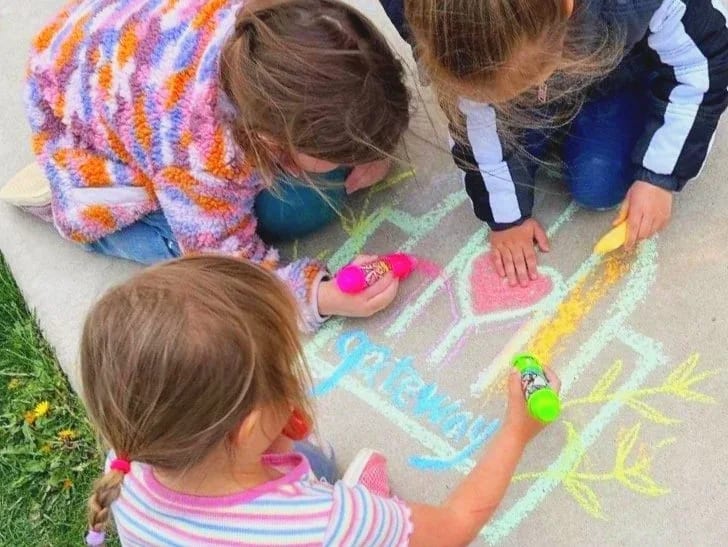 Gateway Montessori School children drawing outdoors