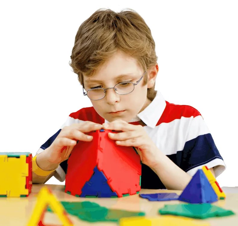 Young child playing with colorful building blocks