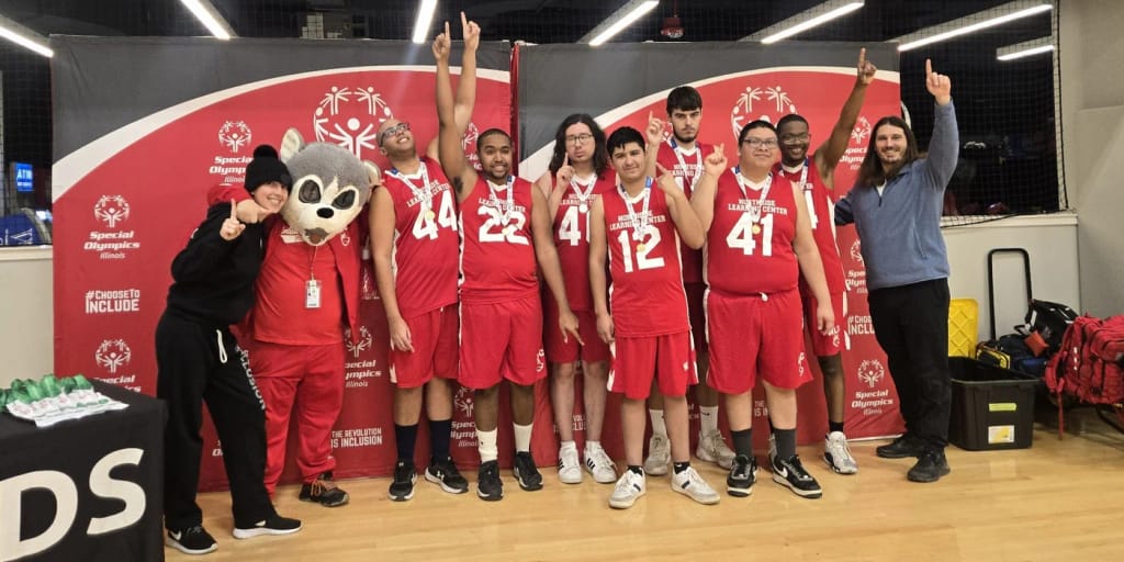 The school basketball team at an event at Northside Learning Center High School