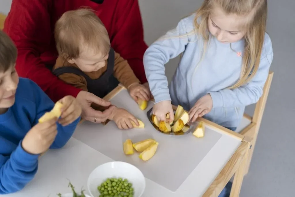 Children participating in a hands-on daily-living activity at i-CAN Children's Therapy.