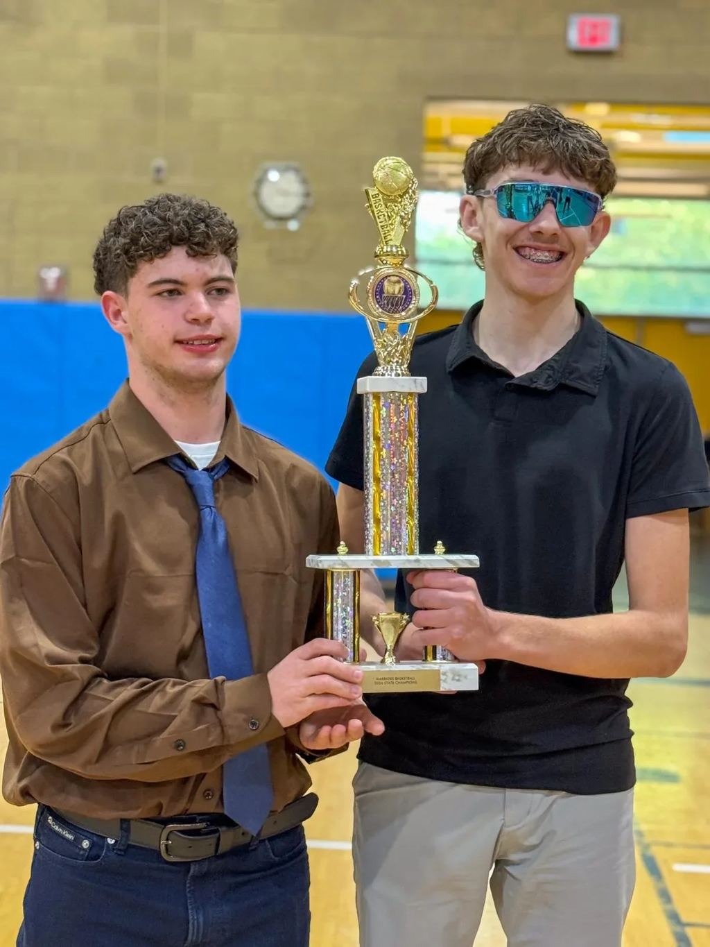 Gateway Academy students celebrate with a basketball trophy
