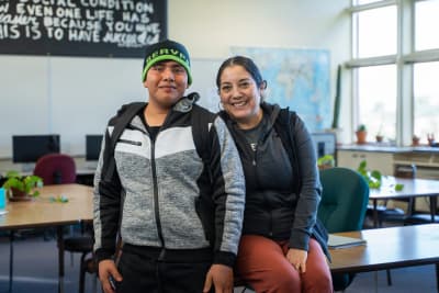 San Luis Coastal Adult School student and instructor in a classroom.