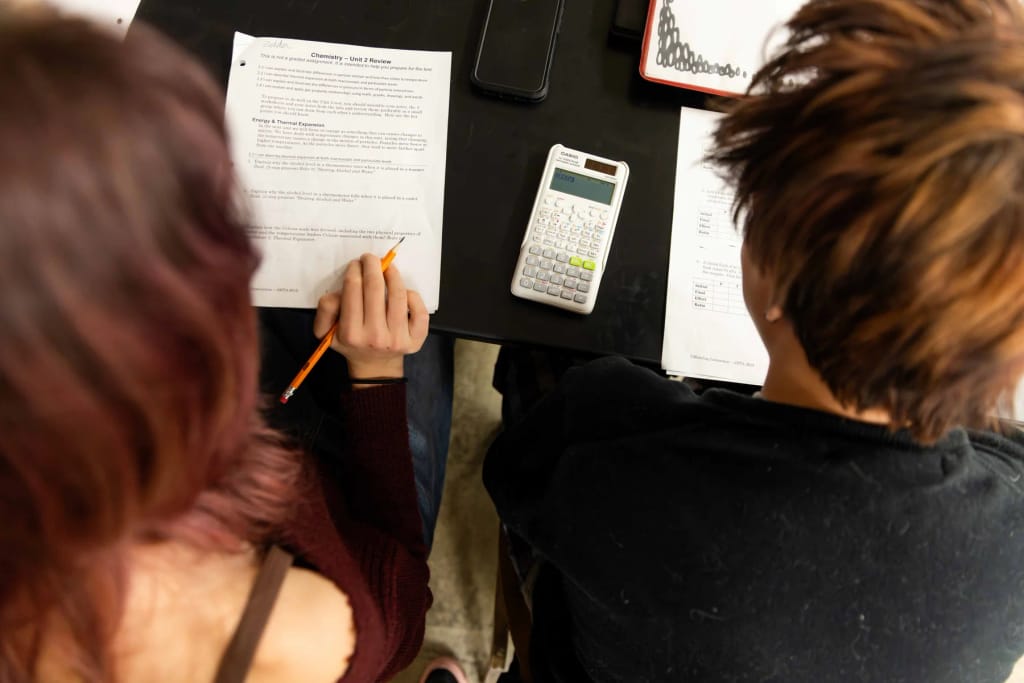 Adult and student working together at Kansas City Academy